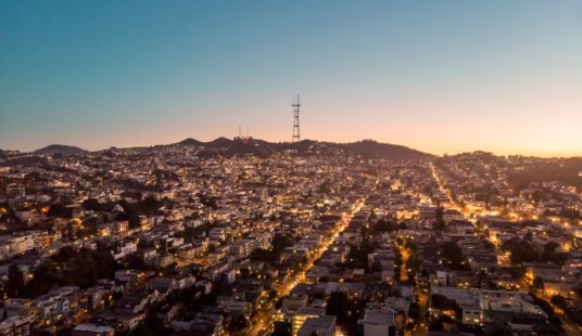 aerial view of city under blue sky during daytime
